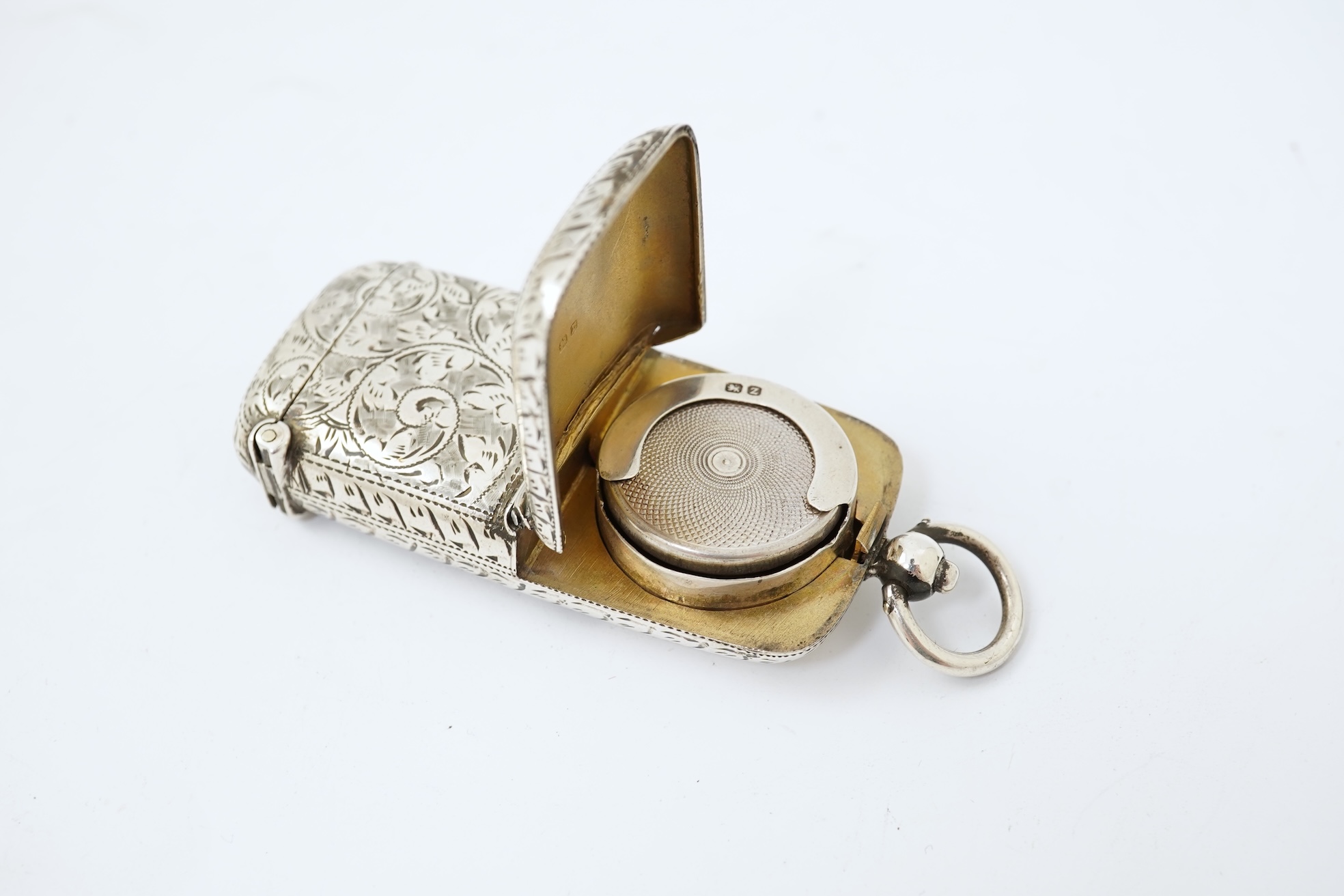 A late Victorian engraved silver oval combination sovereign and vesta case, by W H Tandy & Sons